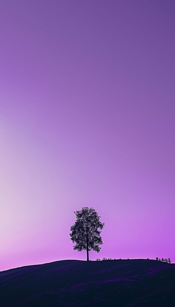 A solitary tree silhouetted against a gradient purple sky on a sloping hill, intended as iPhone wallpaper or phone background.